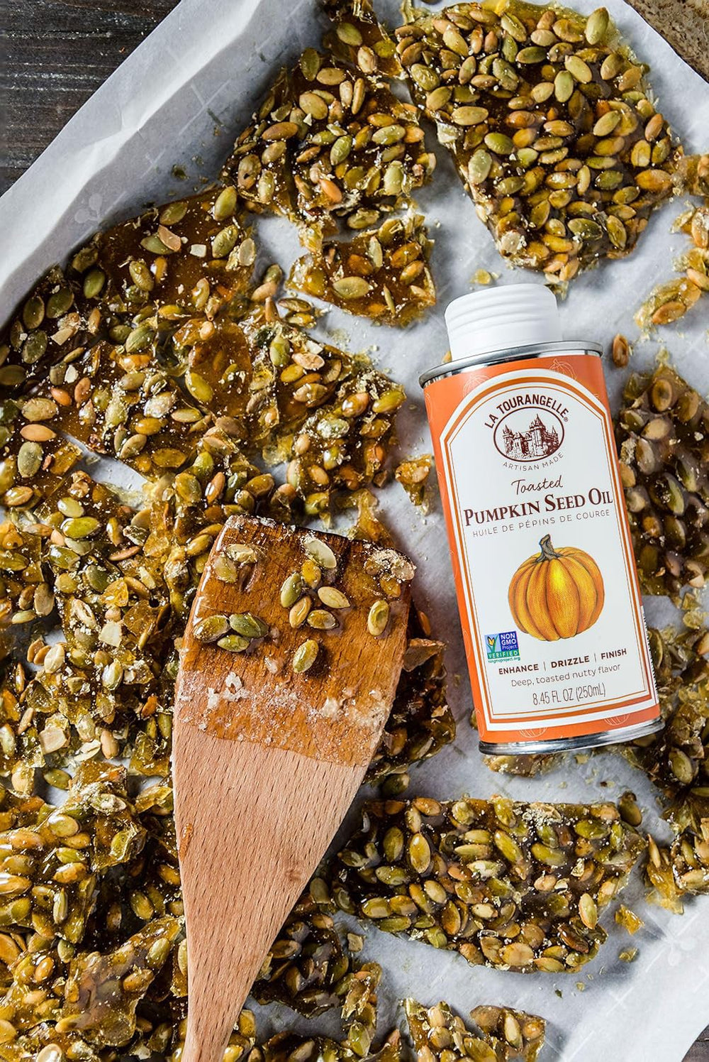 La Tourangelle pumpkin seed oil closeup highlights golden color and texture.