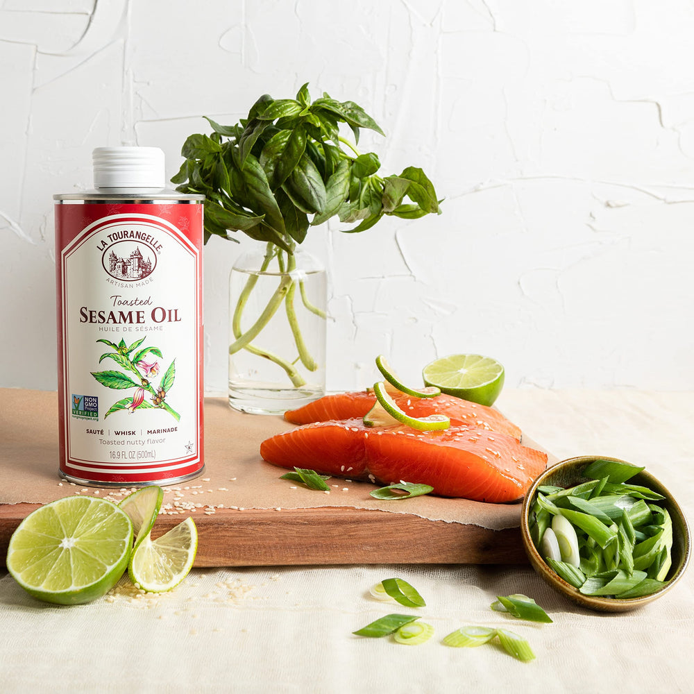 La Tourangelle Toasted Sesame Oil bottle on table, pairs well with proteins and vegetables.