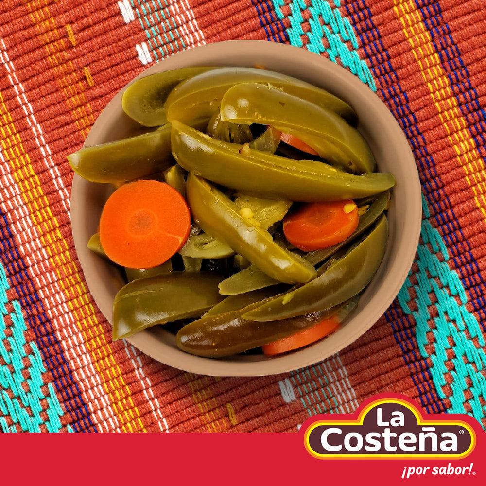 La Costeña jalapeños in a bowl boost salads with smoky warmth.
