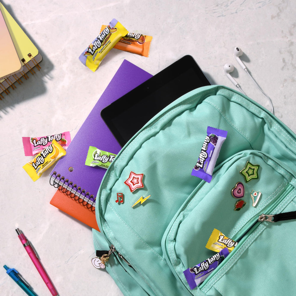 Laffy Taffy mini bars texture close-up, creamy chew with fruity notes.