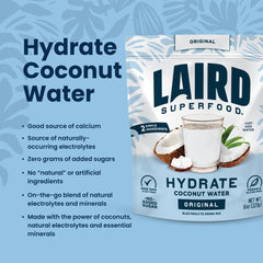 Pouring HYDRATE powder into a glass for a refreshing drink.