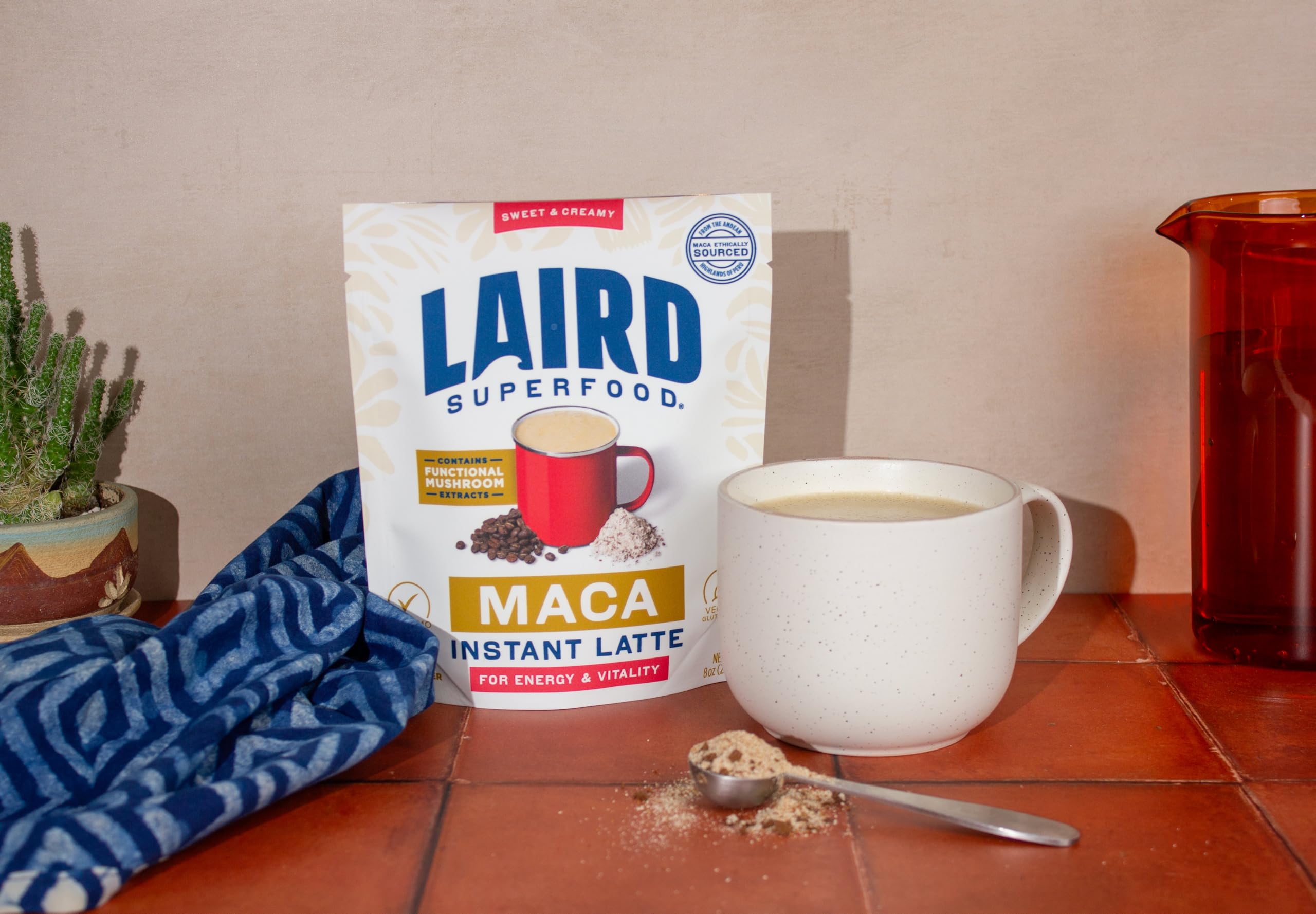 Glass of Laird Superfood Maca Instant Latte, dairy-free comfort for on-the-go mornings.