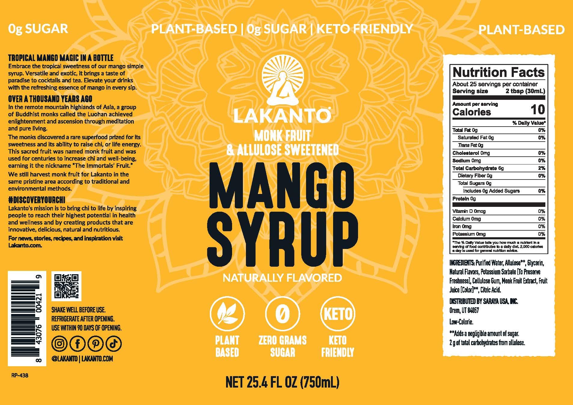 Lakanto Mango Syrup in a cocktail glass with ice and citrus.