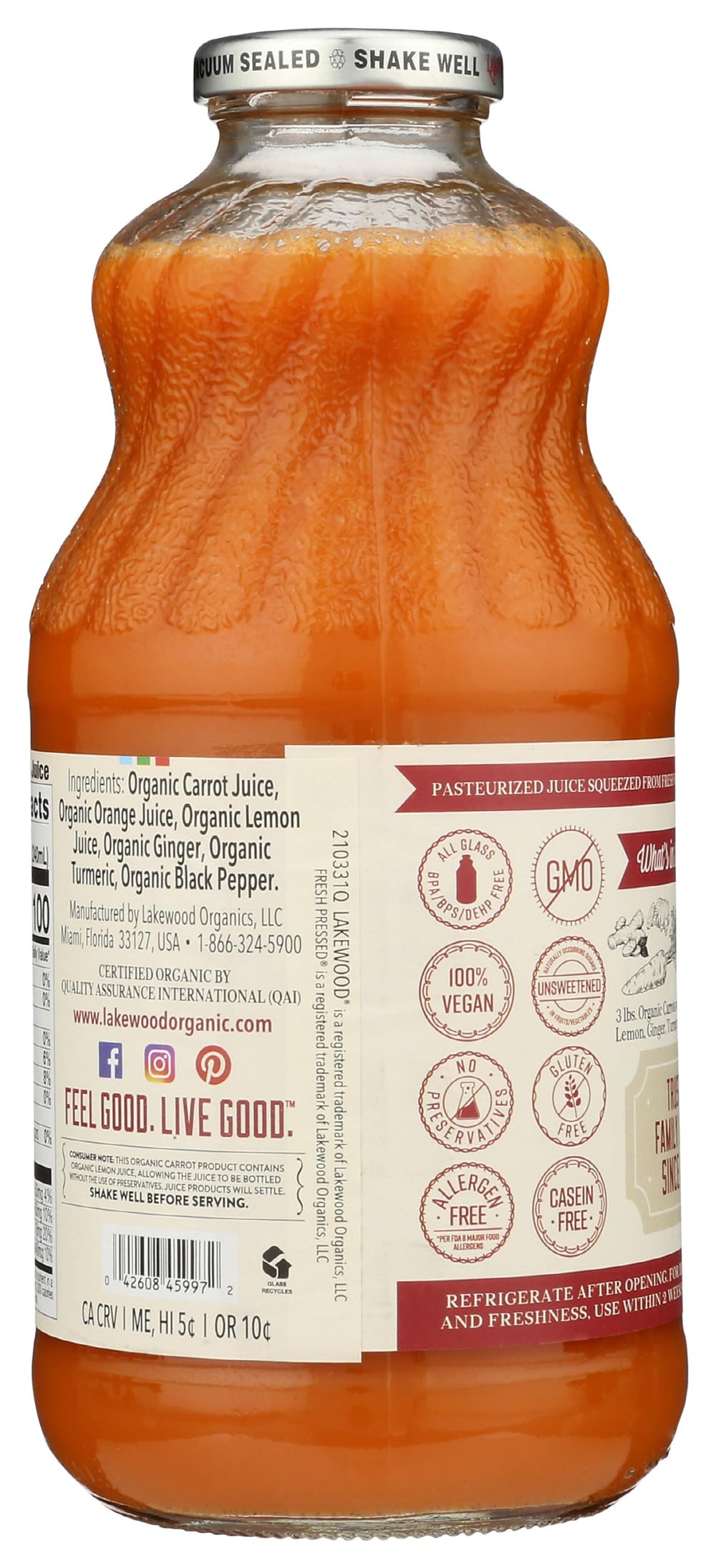 Close-up of Lakewood 32oz bottle showing fresh pressed carrot, ginger, turmeric.