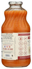 Close-up of Lakewood 32oz bottle showing fresh pressed carrot, ginger, turmeric.