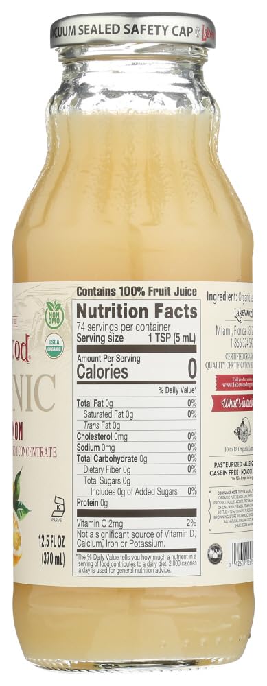 Pouring Lakewood Lemon Pure Organic juice into a glass for beverages.