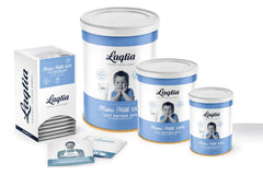 Pouring Laqtia milk from a packet into a glass for quick, ready-to-drink milk.