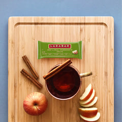LÄRABAR Apple Pie bar bite showcasing cinnamon specks and soft fruit-nut interior.