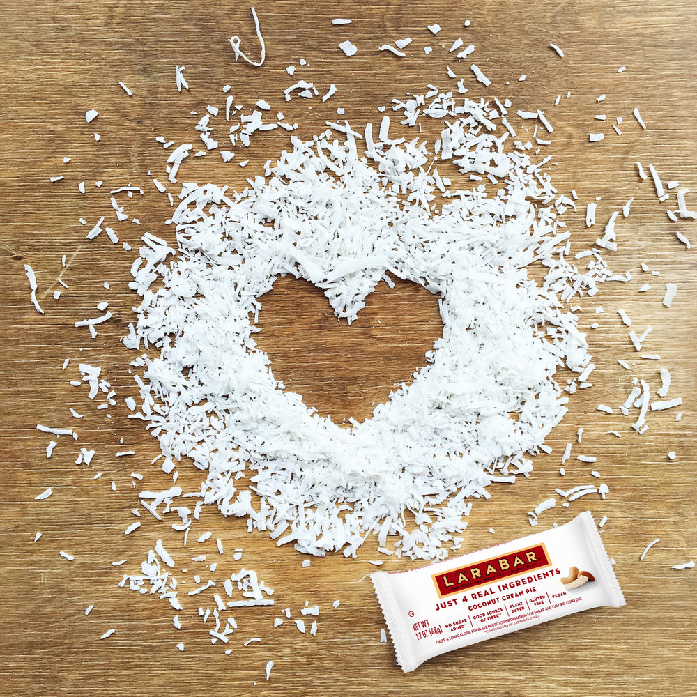 Larabar Coconut Cream Pie bar bite illustrating creamy coconut texture.