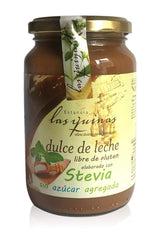 Las Quinas caramel topping serving spoon over jar; great for desserts.