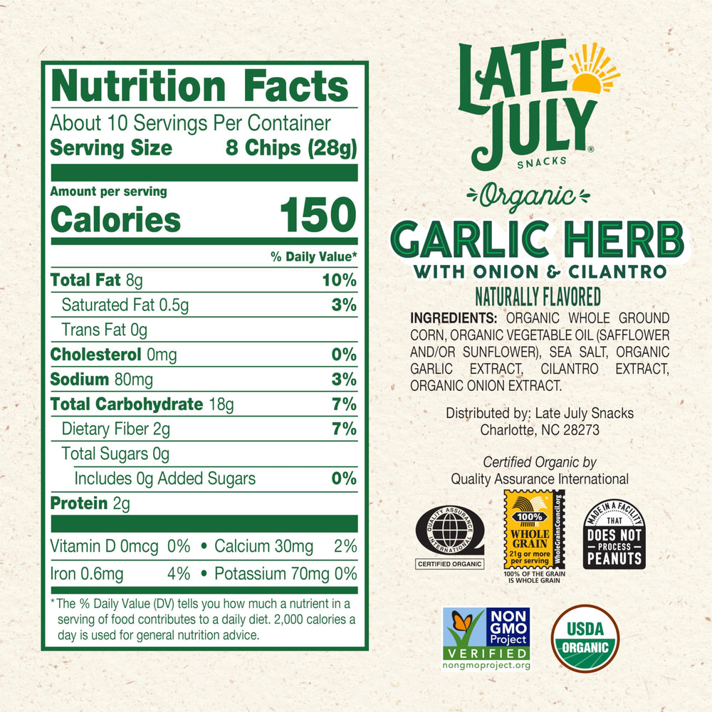Close-up of Late July Garlic Herb Tortilla Chips showing thin crispy texture.