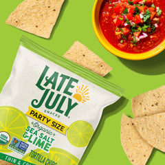 Late July Sea Salt & Lime chips in a bowl with salsa.
