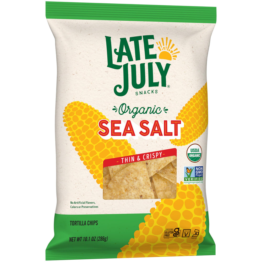 Late July snack setup with family enjoying chips and salsa.