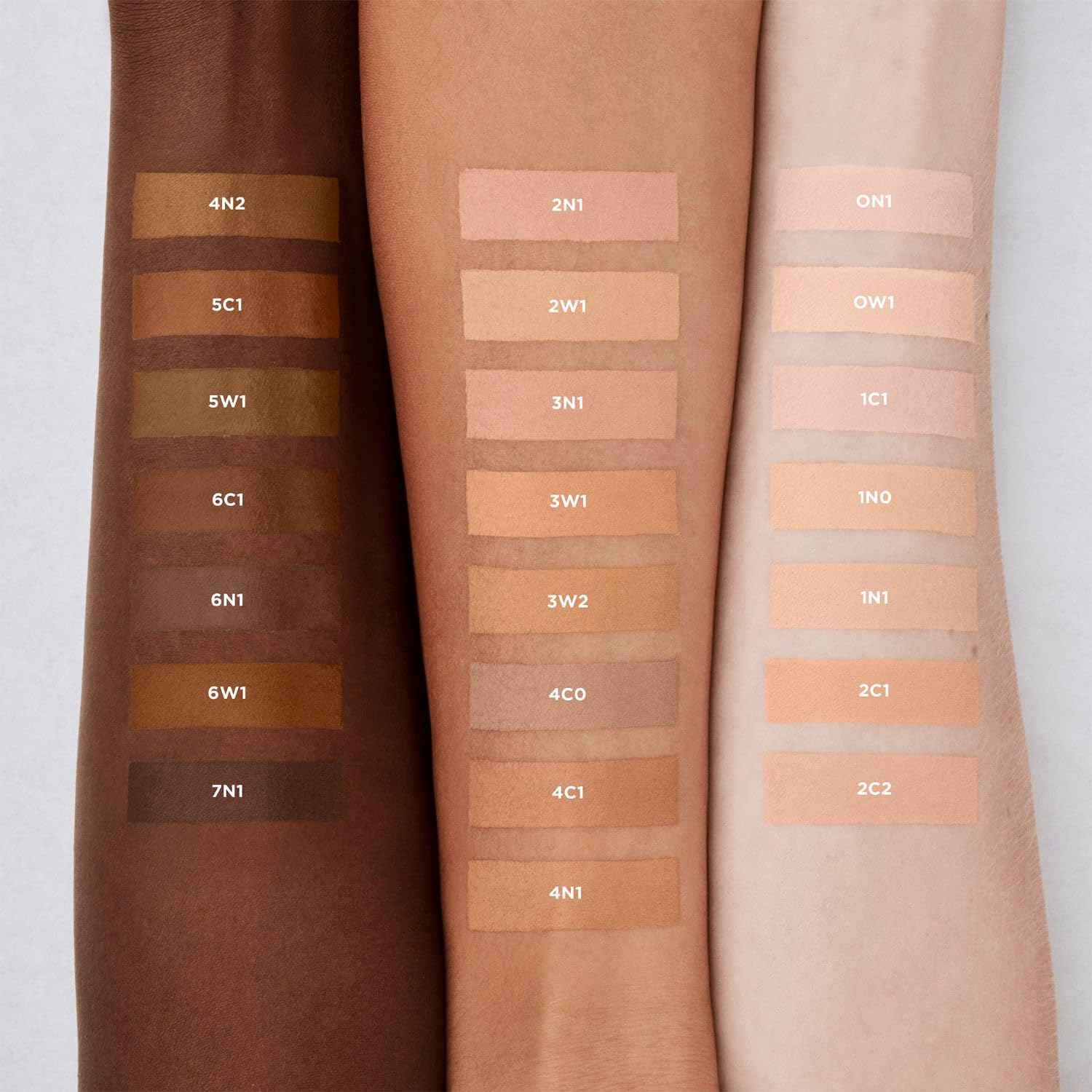 Swatches of Laura Mercier Real Flawless serum concealer on skin showing natural shade match.