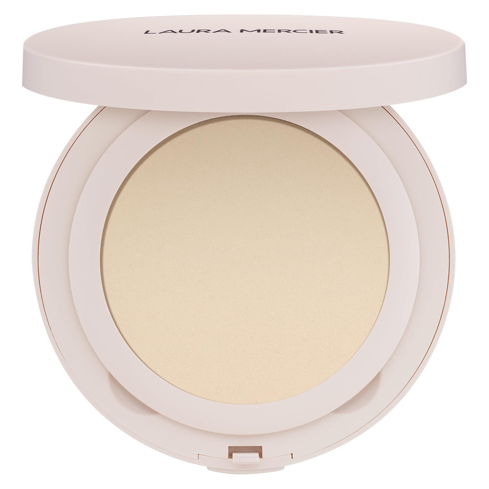 Laura Mercier Ultra-Blur powder compact with puff for on-the-go touch-ups.