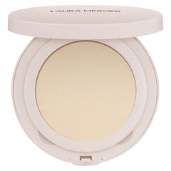 Laura Mercier Ultra-Blur powder compact with puff for on-the-go touch-ups.