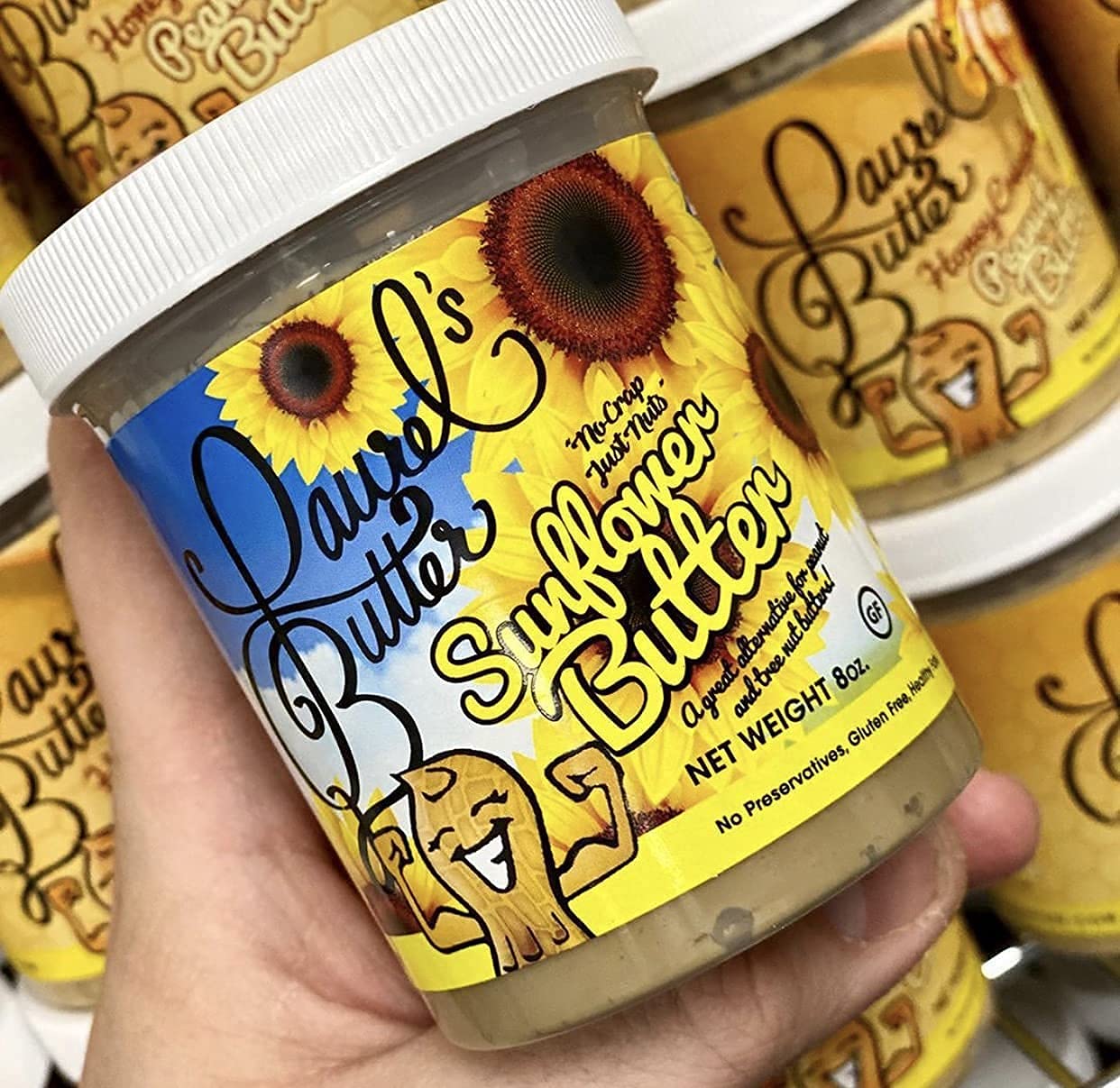 Laurel's Butter sunflower butter jar with spoon ready for snacking.