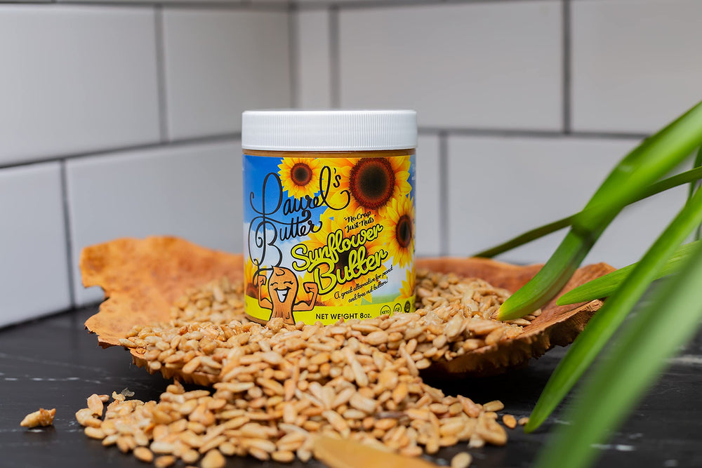 Laurel's Butter sunflower butter bottle beside a smoothie for a meal boost.