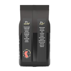 Lavazza Arabica Robusta blend beans in bowl, balanced espresso presence.