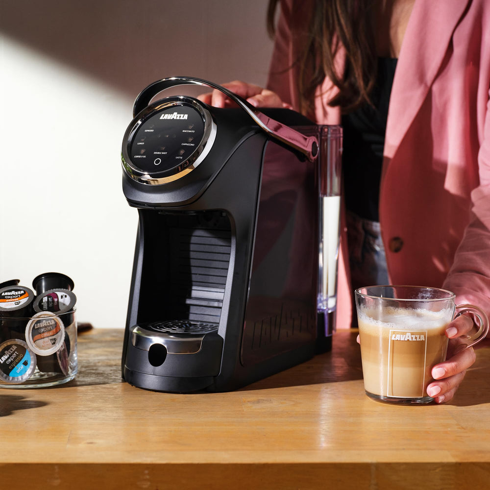 Lavazza Classy machine pouring espresso into cup.