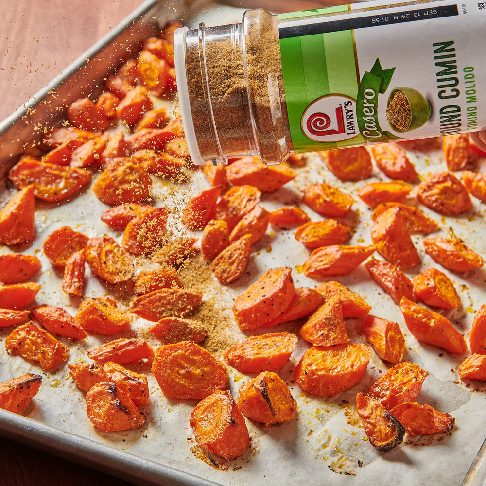 Lawry's Casero Ground Cumin sprinkled into a sauce to enrich Indian curries flavor