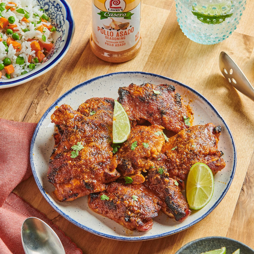 Shaker dusting Lawry's Casero over a sizzling skillet.