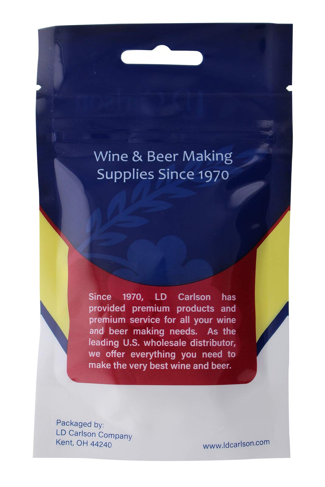 Crushed LD Carlson Campden tablet being mixed into wine for even distribution.