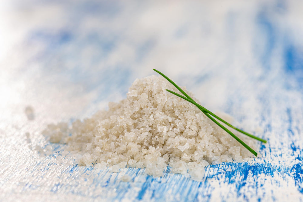 Hand-raked salt process highlights natural texture and moisture for delicate finishing.