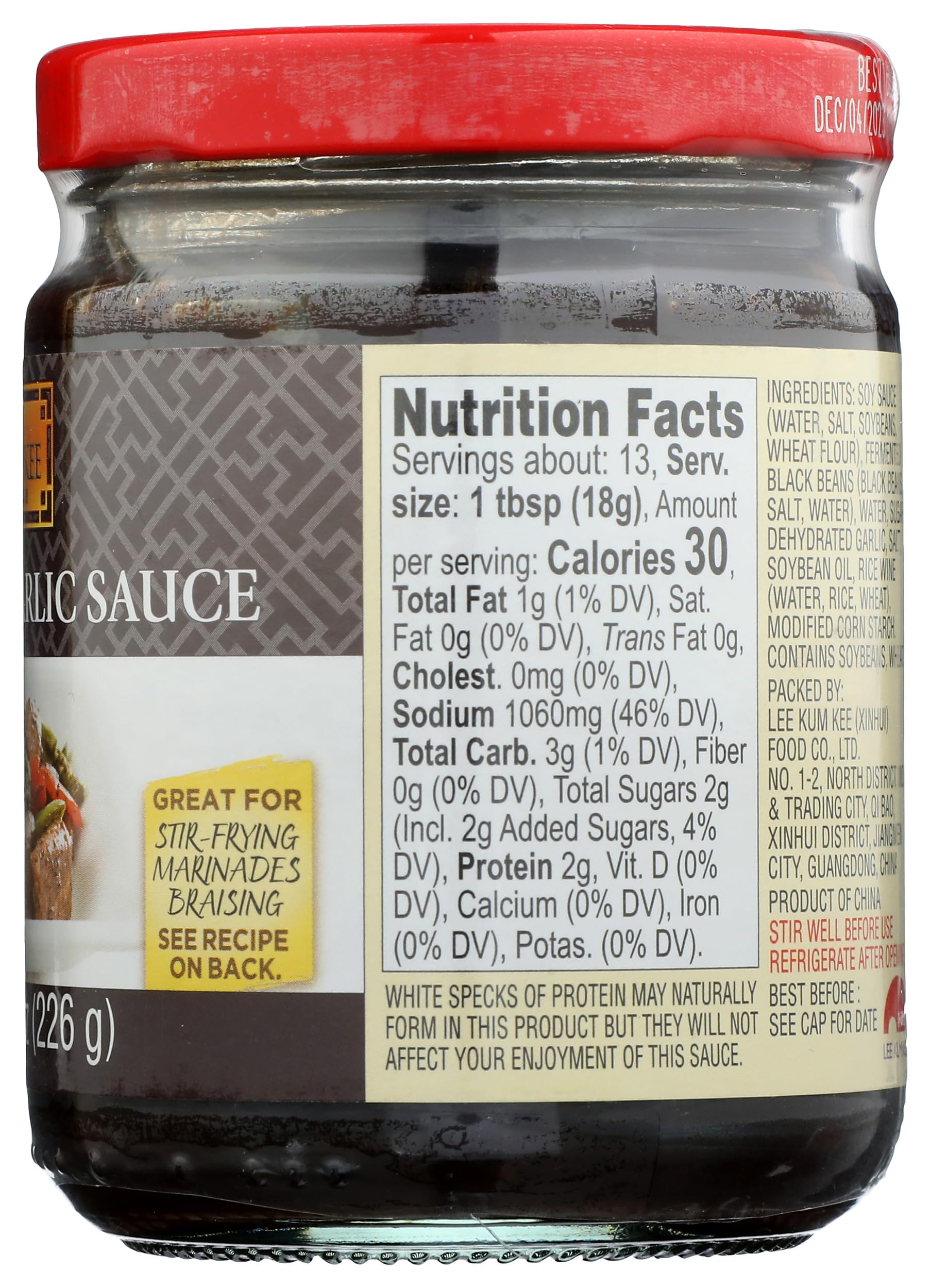 Lee Kum Kee Black Bean Garlic Sauce in a glass bottle on the kitchen counter.