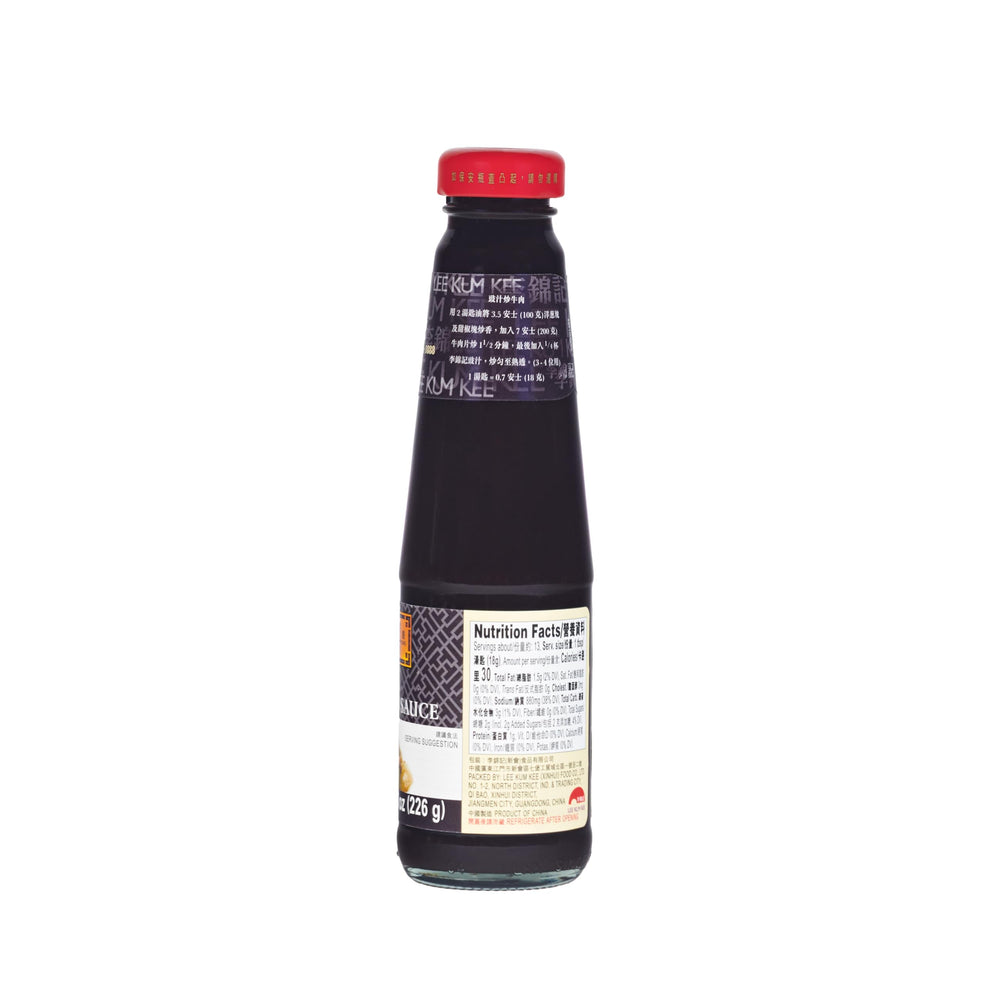 Lee Kum Kee Black Bean Sauce bottle pour over crispy vegetables for rich flavor.