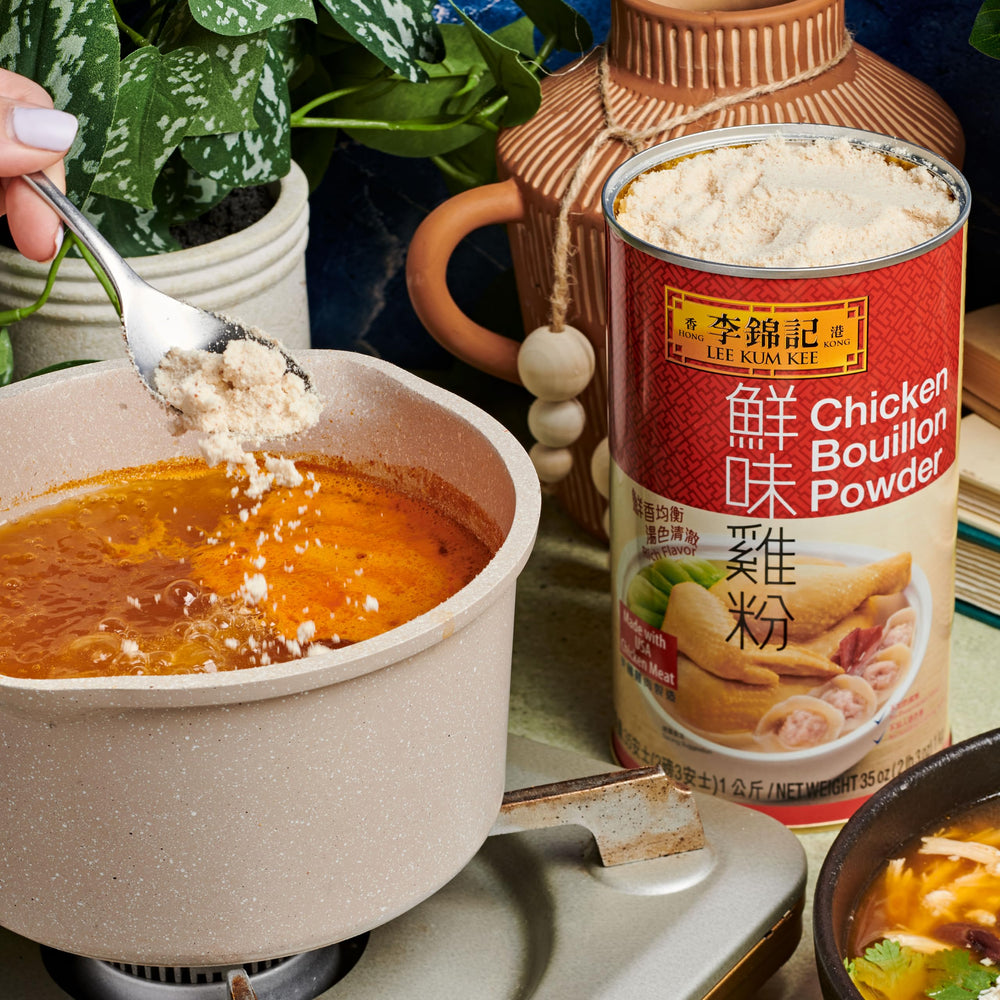 Lee Kum Kee chicken powder in a sizzling stir-fry pan