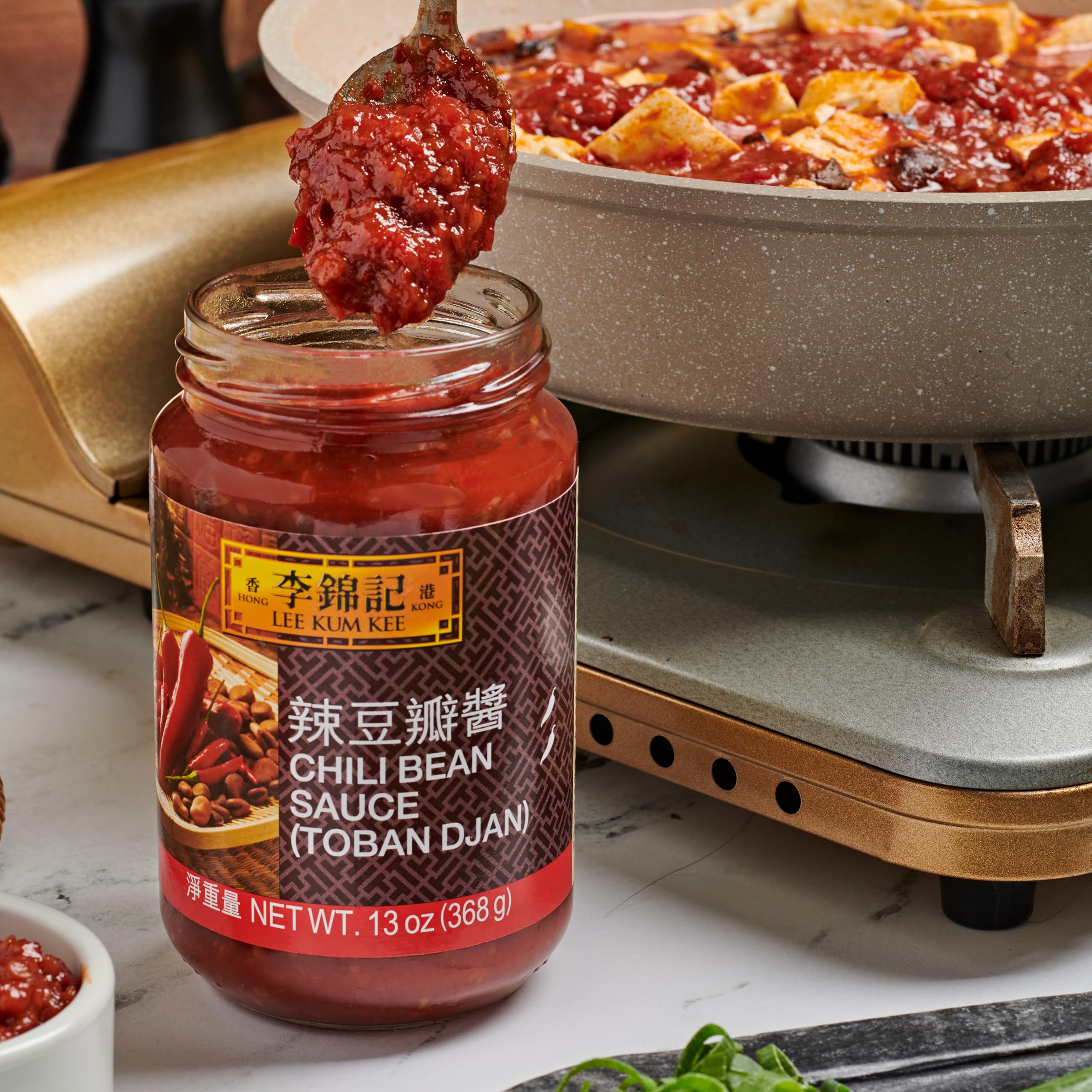 Lee Kum Kee Chili Bean Sauce label close-up highlights rich bean paste aroma.