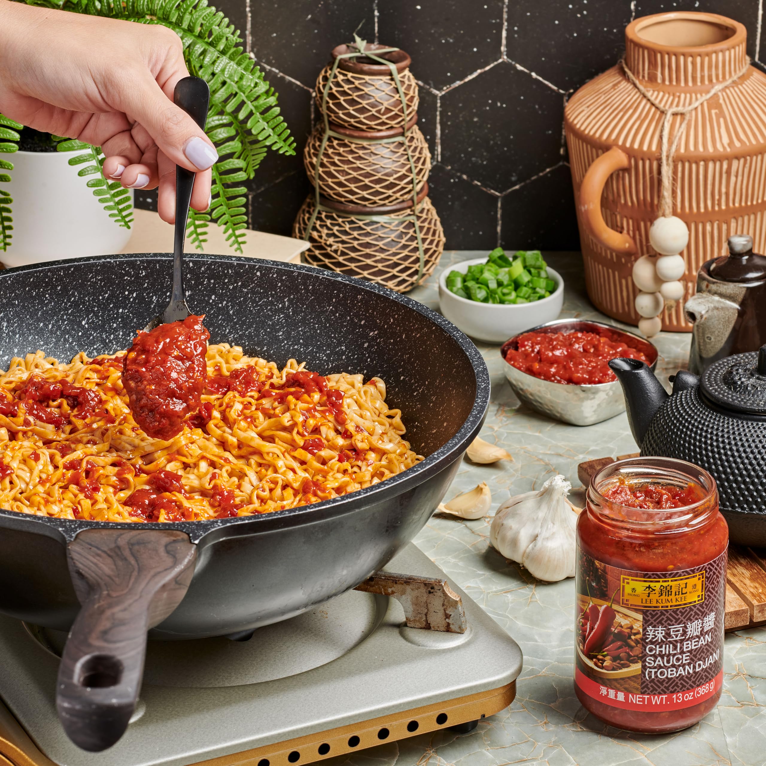 Lee Kum Kee Chili Bean Sauce packaging emphasizes premium quality and convenience.
