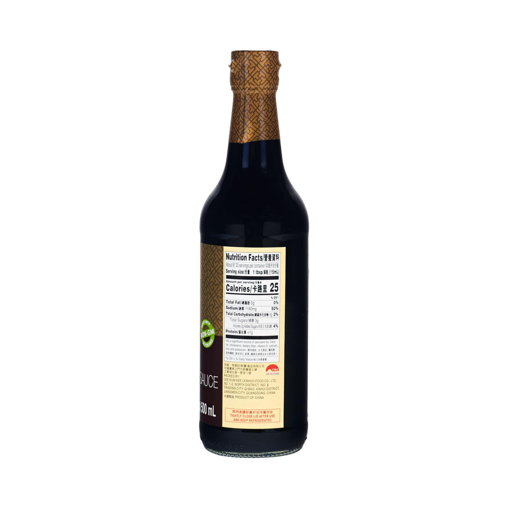 Pouring Lee Kum Kee dark soy sauce to enrich stews with deep umami and color.