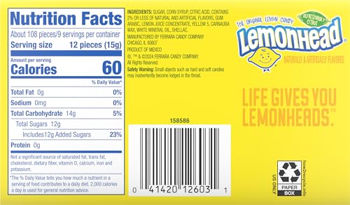 Lemonhead iconic smiley-face close-up highlighting tangy citrus flavor and crisp texture.