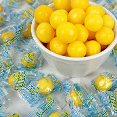 Lemonheads sour candy closeup emphasizes bright citrus and nostalgic texture.