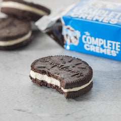 Stacked Complete Cremes cookies show crisp wafers and creamy center