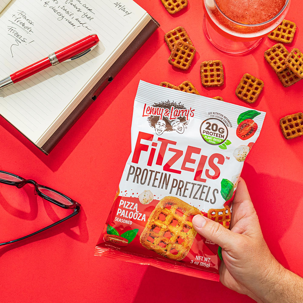 Lenny & Larry's FITZELS Pizza Palooza seals indicating vegan and kosher ingredients.