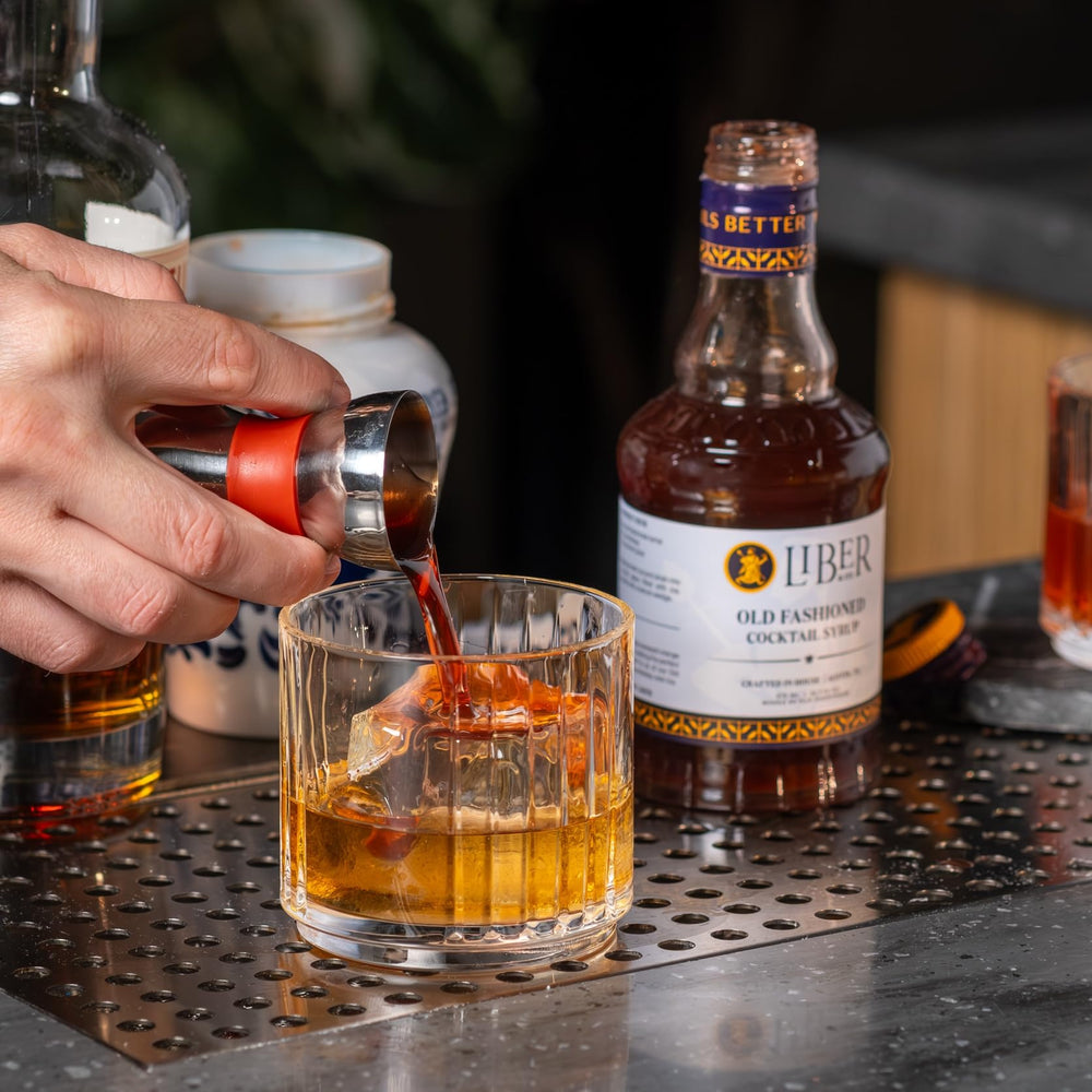 Liber & Co. bottle label detail signals handcrafted, bar-grade ingredients for refined cocktails.