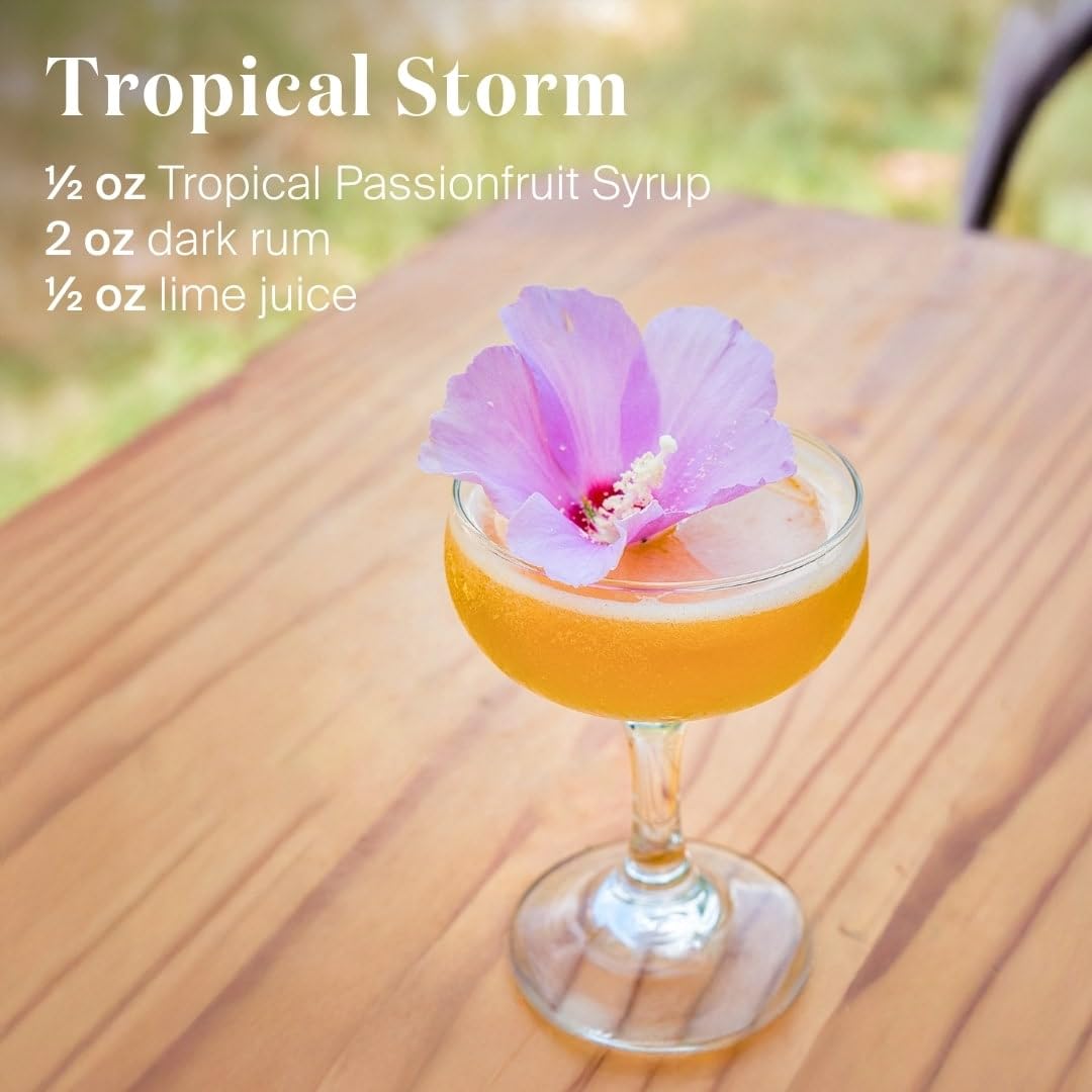 Liber & Co Tropical Passion Fruit Syrup cocktail glass with vibrant color for tropical drinks.
