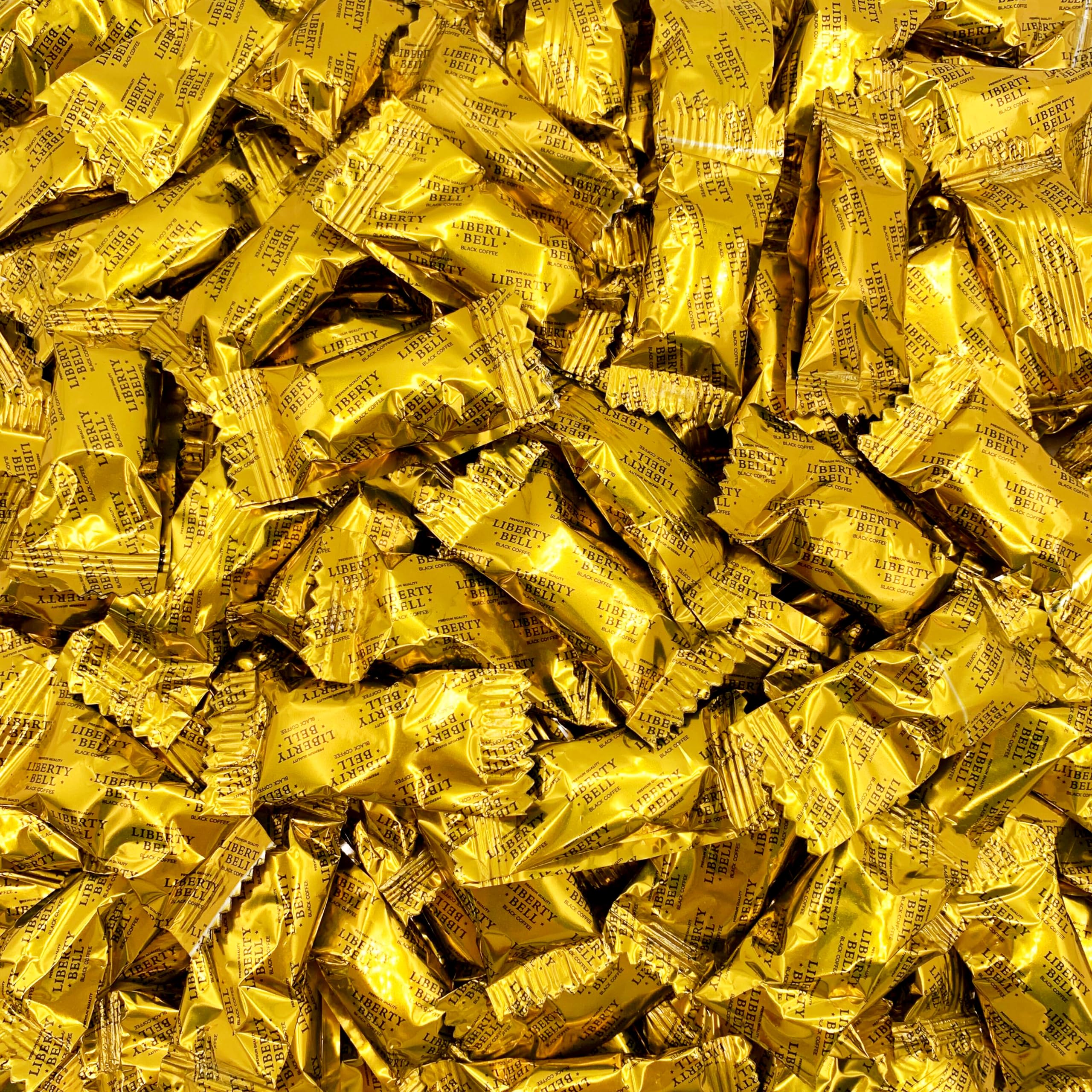 LIBERTY BELL Brazilian coffee candy in a 1 lb bag on a desk for office use.