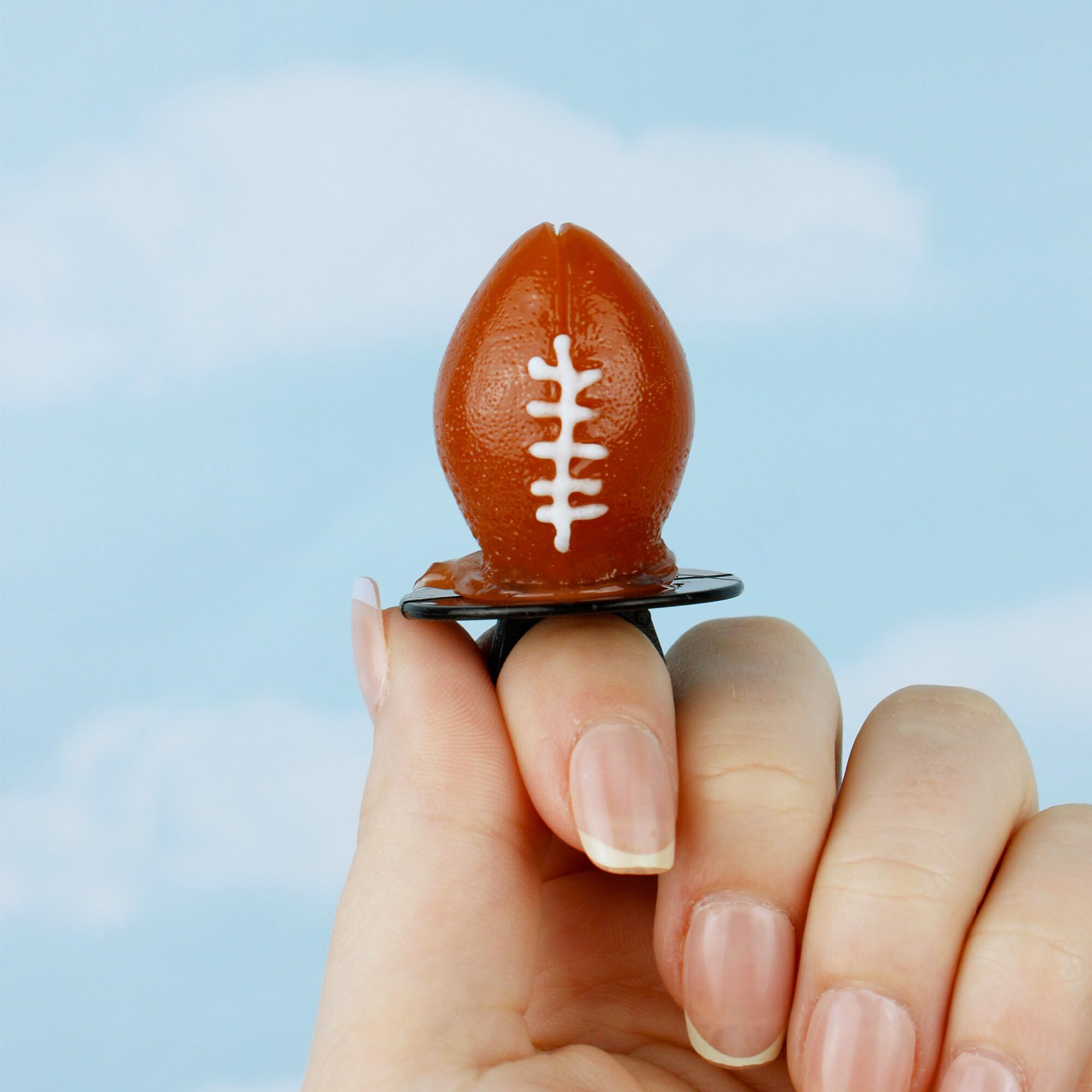 Lil' League Football Lollipop Rings on a party table for sports celebrations
