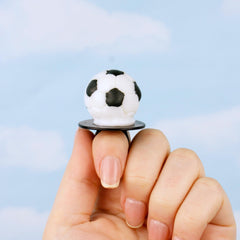 Lil' League soccer ball lollipop ring closeup shows fruity flavor