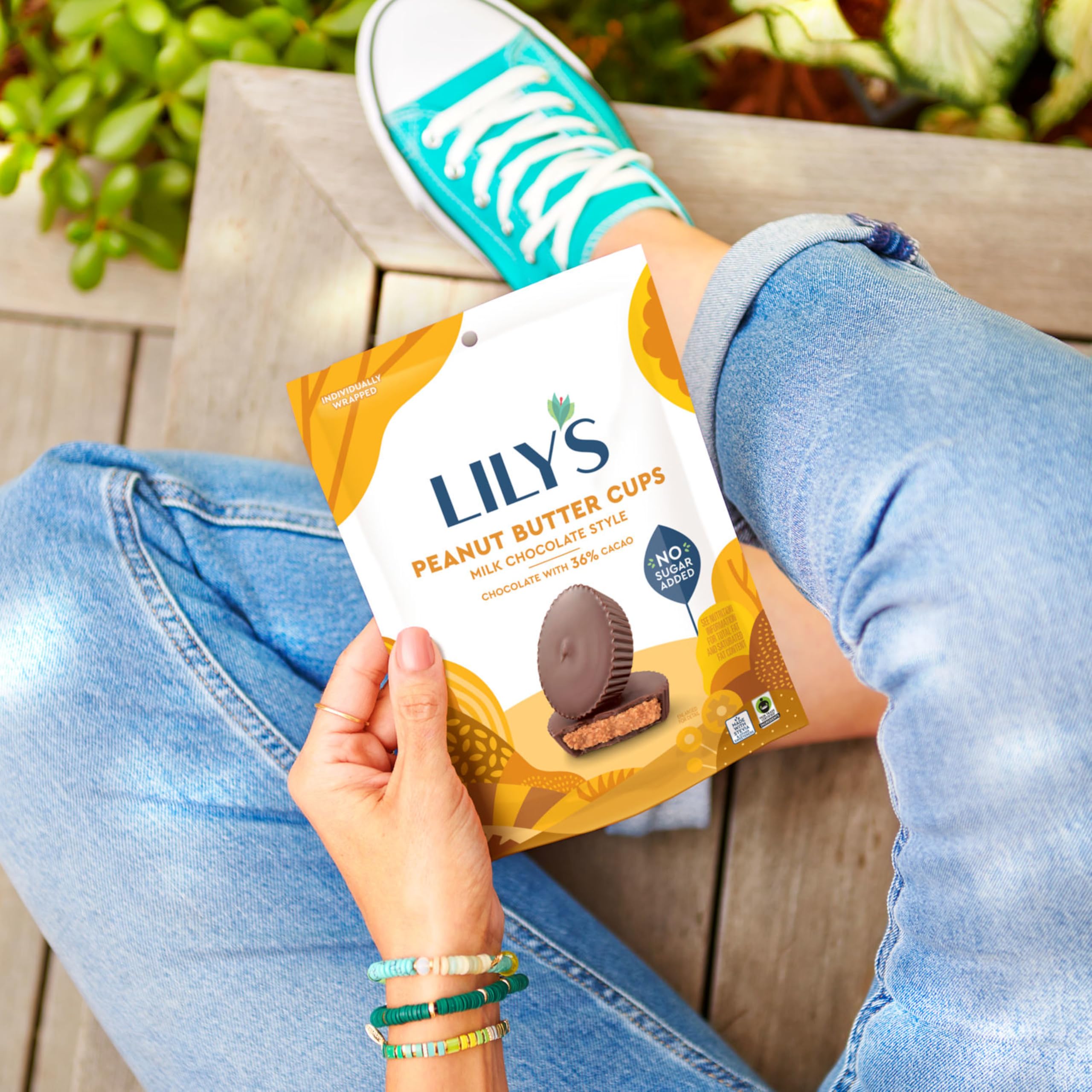 LILY'S no sugar added peanut butter cups texture-slice, reveals smooth center.