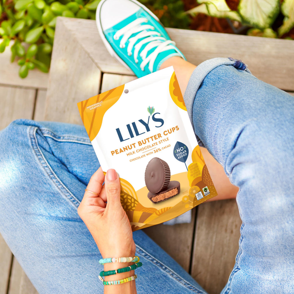 LILY'S no sugar added peanut butter cups texture-slice, reveals smooth center.