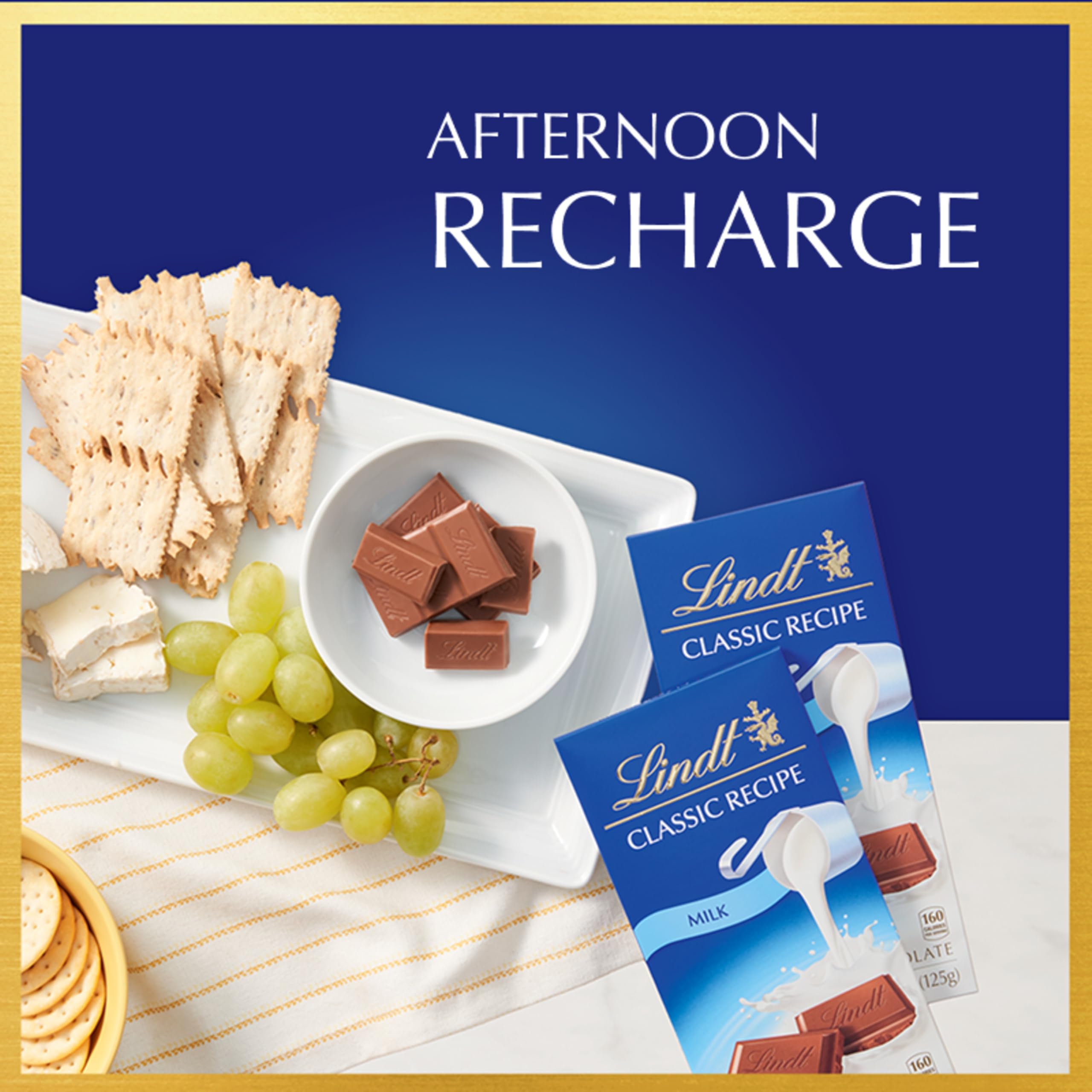 Lindt CLASSIC RECIPE Milk Chocolate Bar bite-sized pieces ready to enjoy.