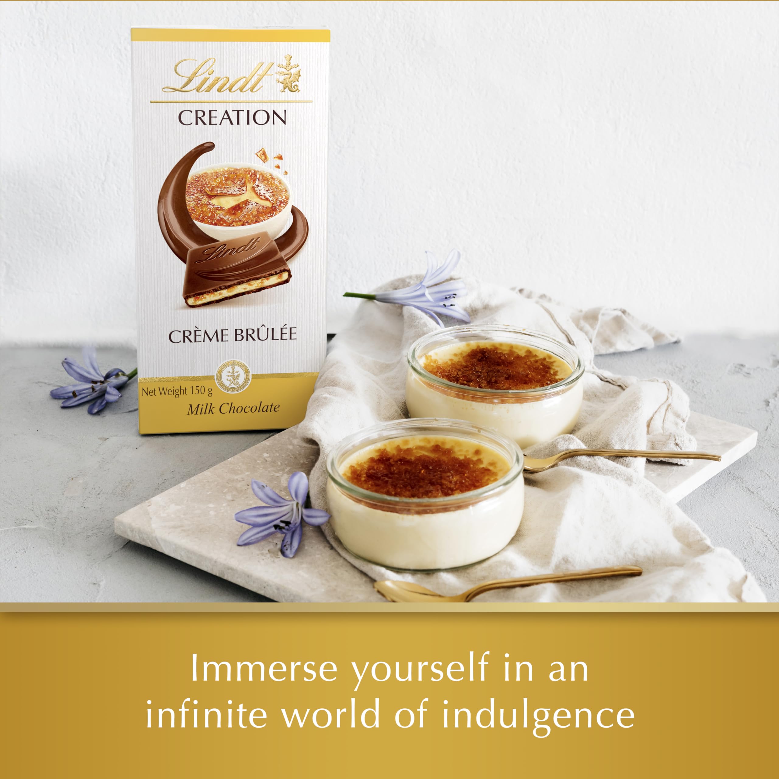 Lindt Creation Creme Brulee bar sliced on a wooden board
