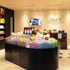 Lindt Creation Refreshing Lemon packaging highlights premium branding and resealable wrap for freshness.