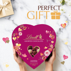 Lindt heart gift box accents romance, ideal for a cozy at home evening
