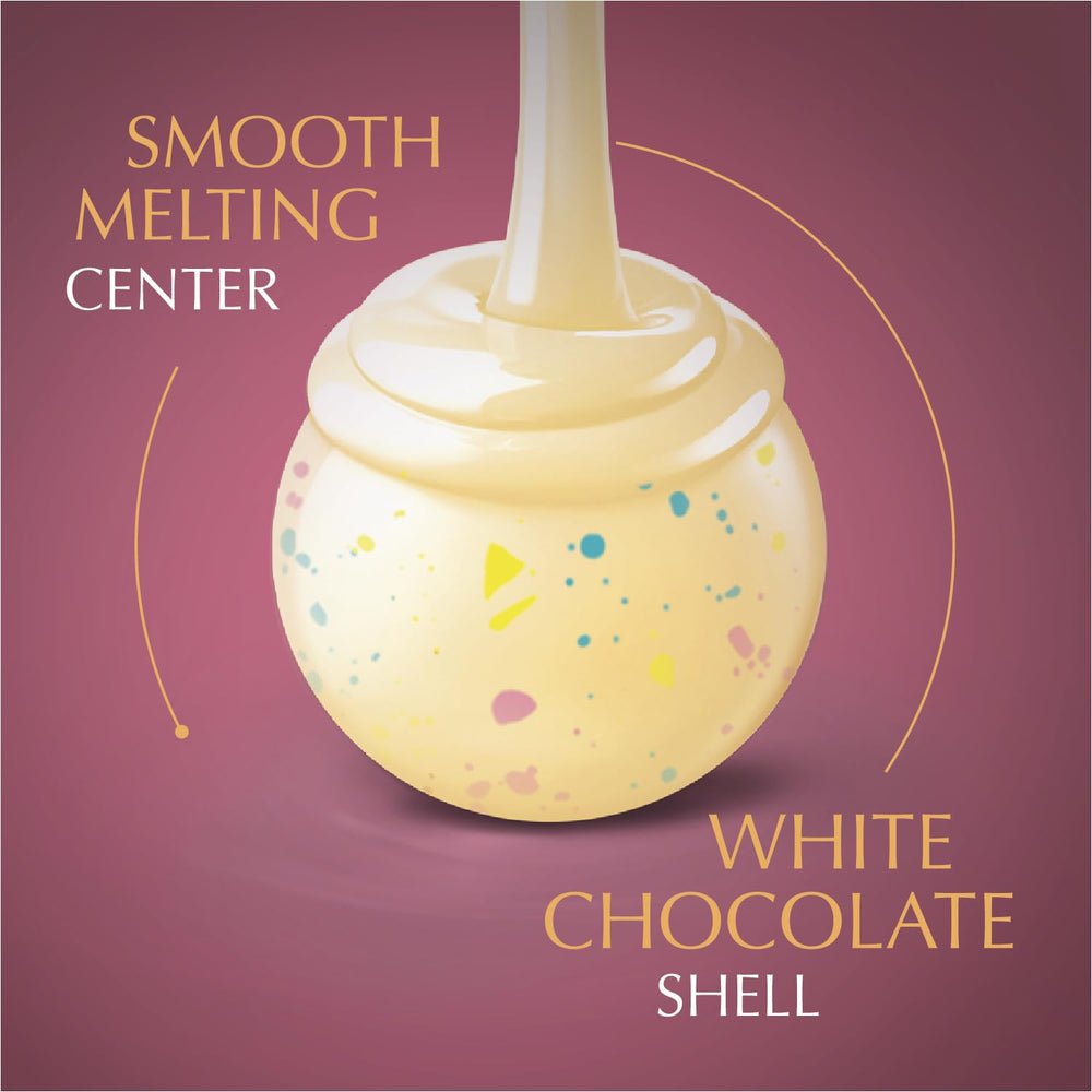 Lindt LINDOR Birthday Cake shell close-up, smooth white chocolate texture.
